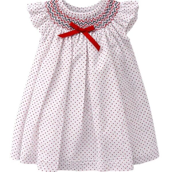 #VestidoInfantil #ModaNiñas #VestidoClásico #EstiloElegante #LunaresInfantiles #BordadoSmock #VestidoConLazo #ModaAtemporal #EventosEspeciales #CreacionesFlérida